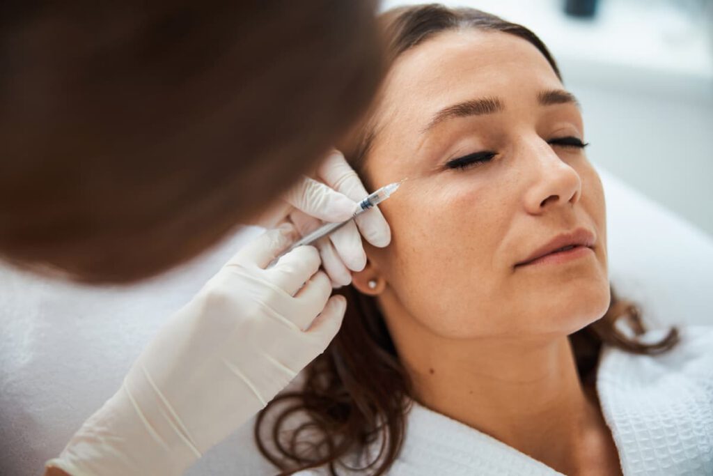 Anticipating a smoother, younger appearance: A woman about to receive a Xeomin treatment for wrinkle reduction.