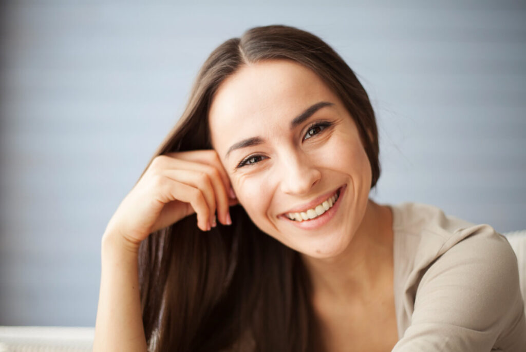 Close up portrait of attractive young woman at home