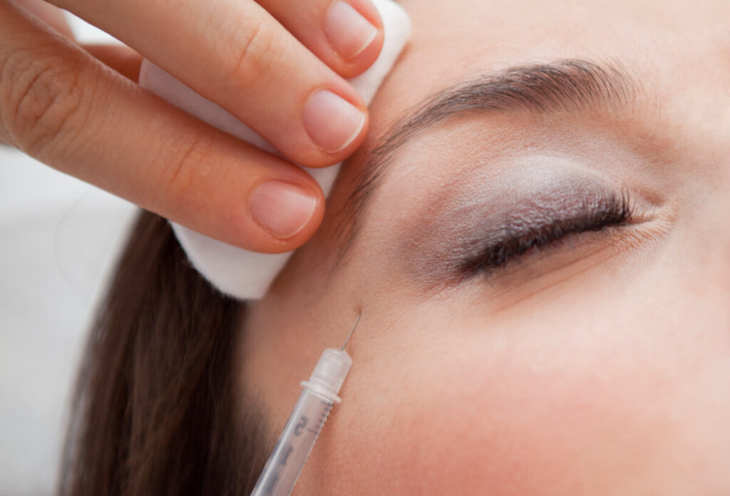 cosmetic injection of botox to the pretty female face