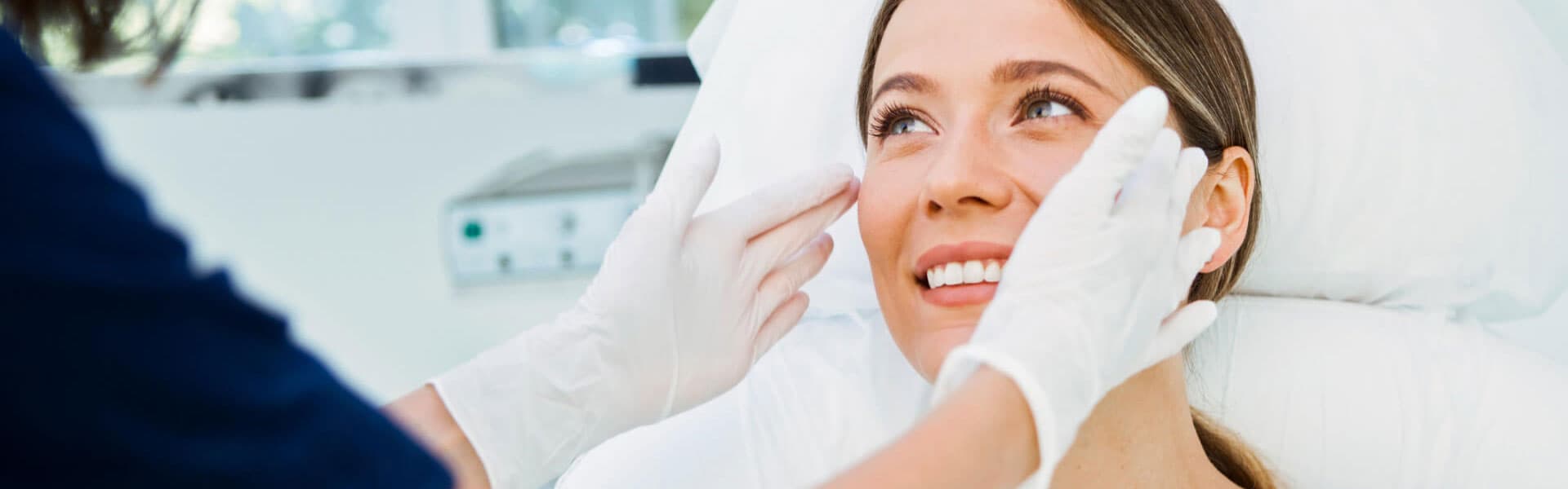 Cosmetologist preparing to doing cosmetic facial treatments for the young woman