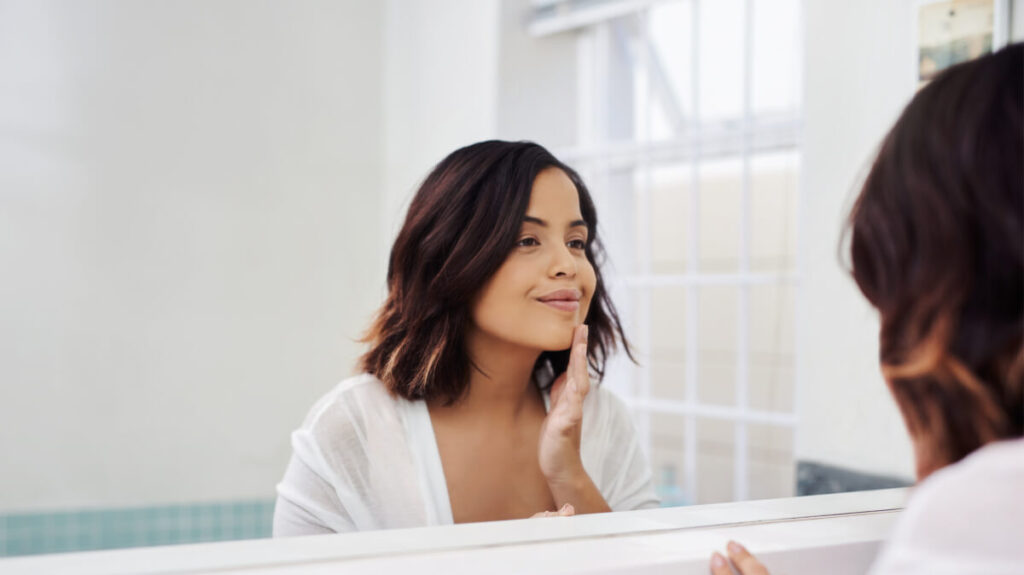 Shot of an attractive young woman going through her morning beauty routine in the bathroom