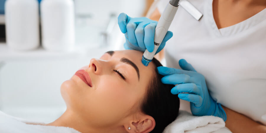 woman getting Hydrafacial treatment