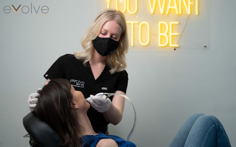 woman getting hydrafacial at Evolve Med Spa