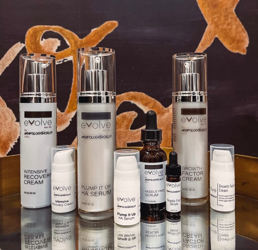  Evolve Med Spa’s Unapologetically You Skincare Line in full size and travel size on a table