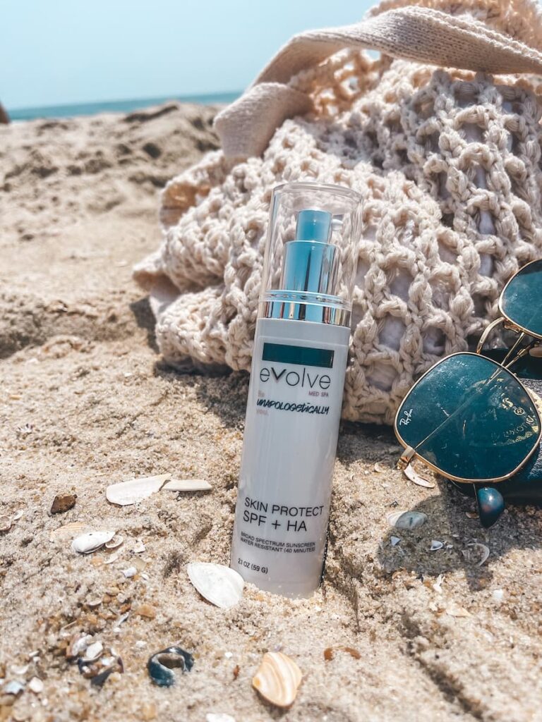 Evolve’s Skin Protect SPF + HA helping protect client’s skin from the sun damage on the beach