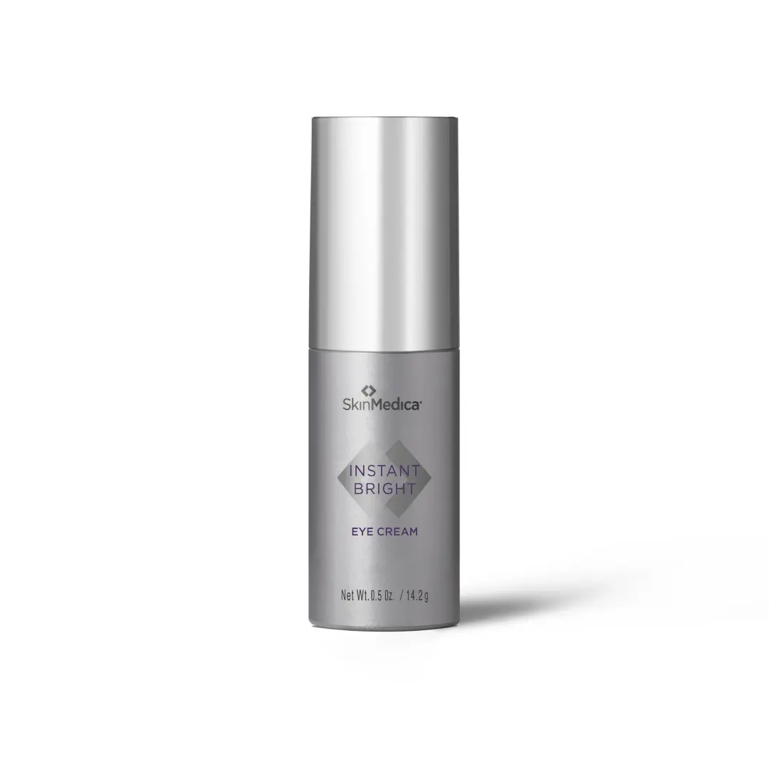 A bottle of SkinMedica Instant Bright Eye Cream with a sleek silver design.