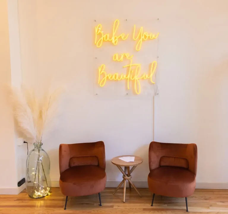 Lobby of Montclair Evolve with neon sign reading Babe you are Beautiful